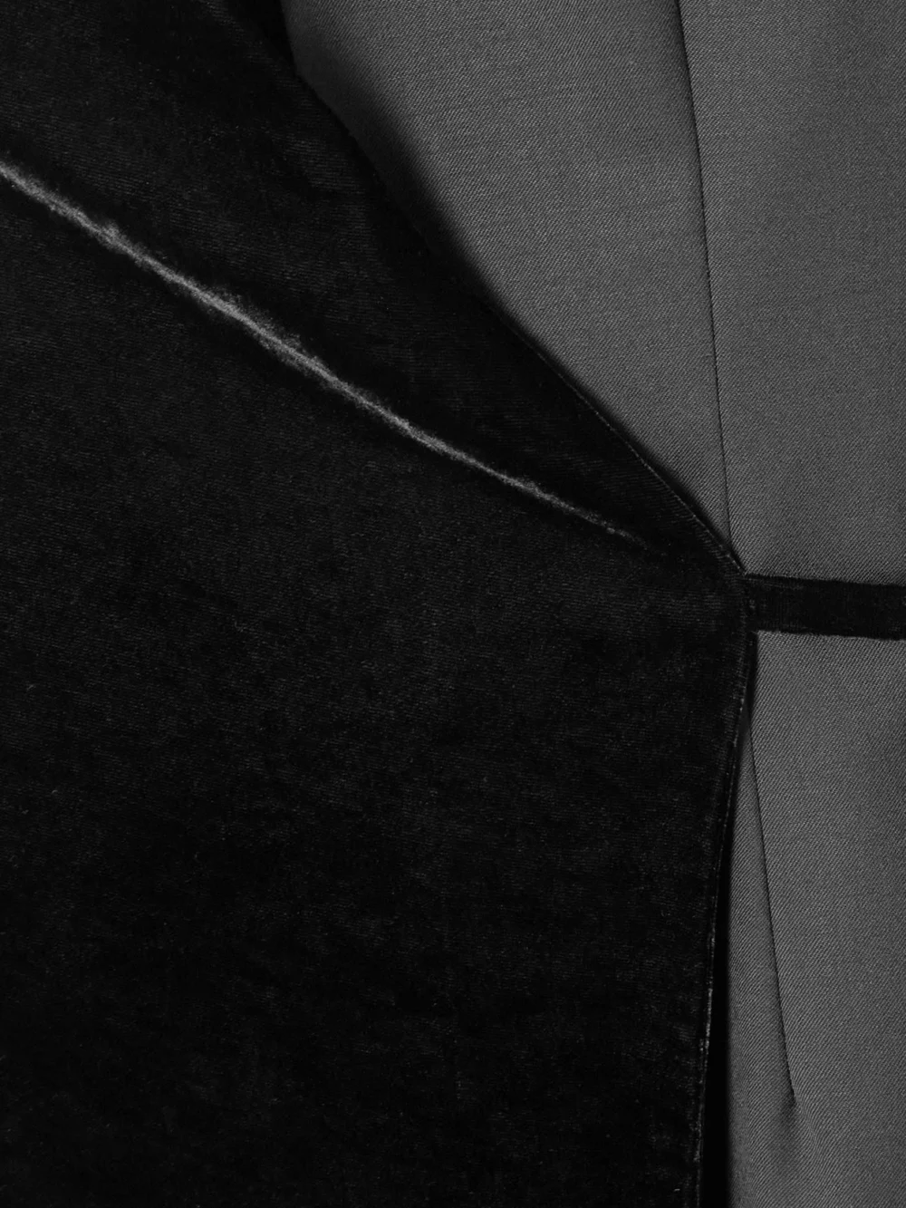 Close-up detail of the Abadia Asymmetric Velvet and Wool-blend Twill Wrap Midi Dress
