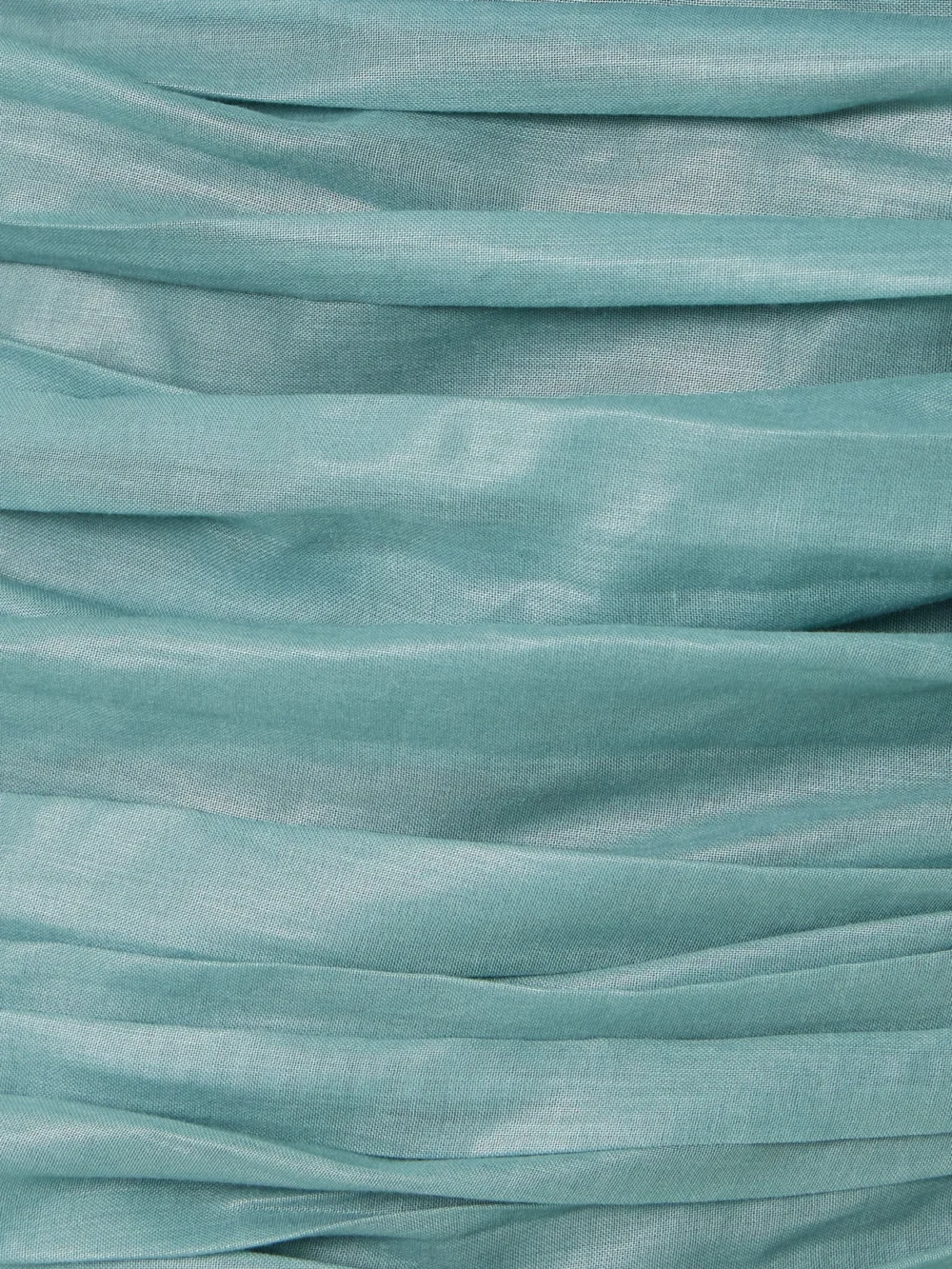 Close-up detail of the Abadia Lulu One-shoulder Gathered Voile Mini Dress