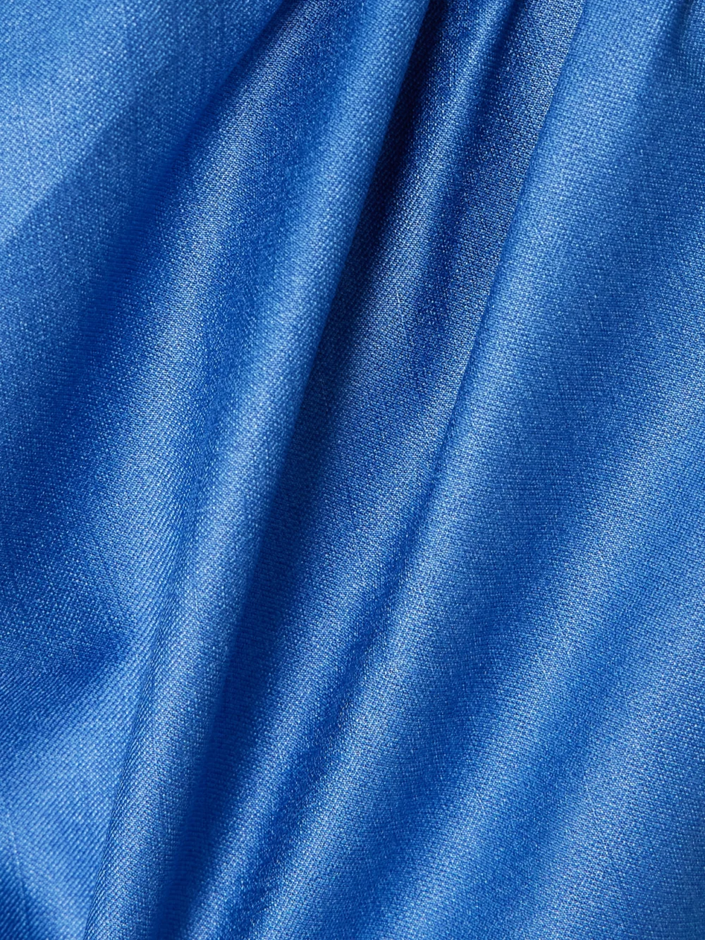 Close-up detail of the Abadia Mira Layered Knotted Charmeuse Midi Dress