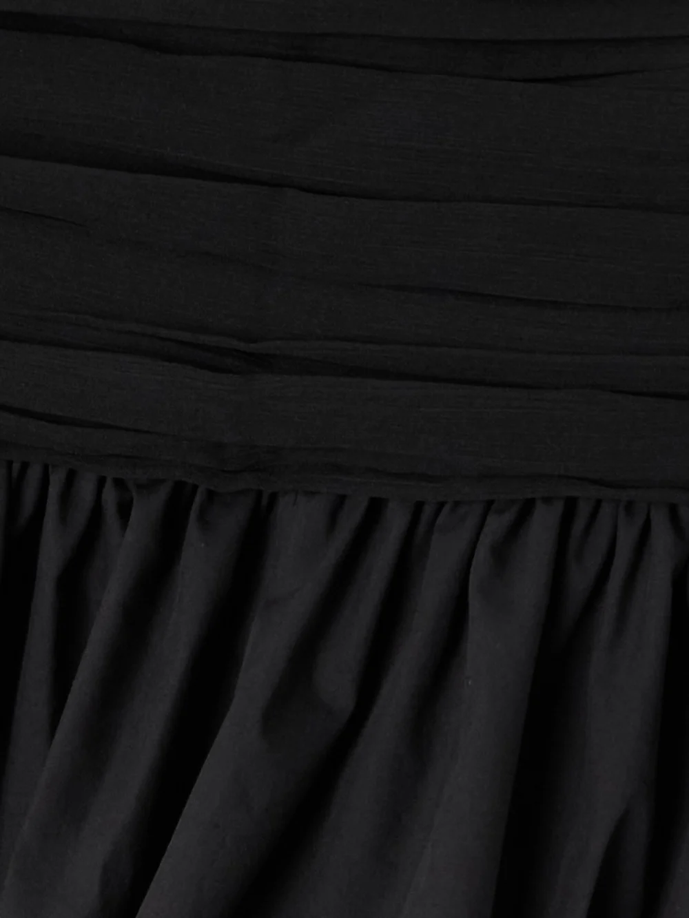 Close-up detail of the Abadia Ruched Chiffon-trimmed Poplin Mini Skirt