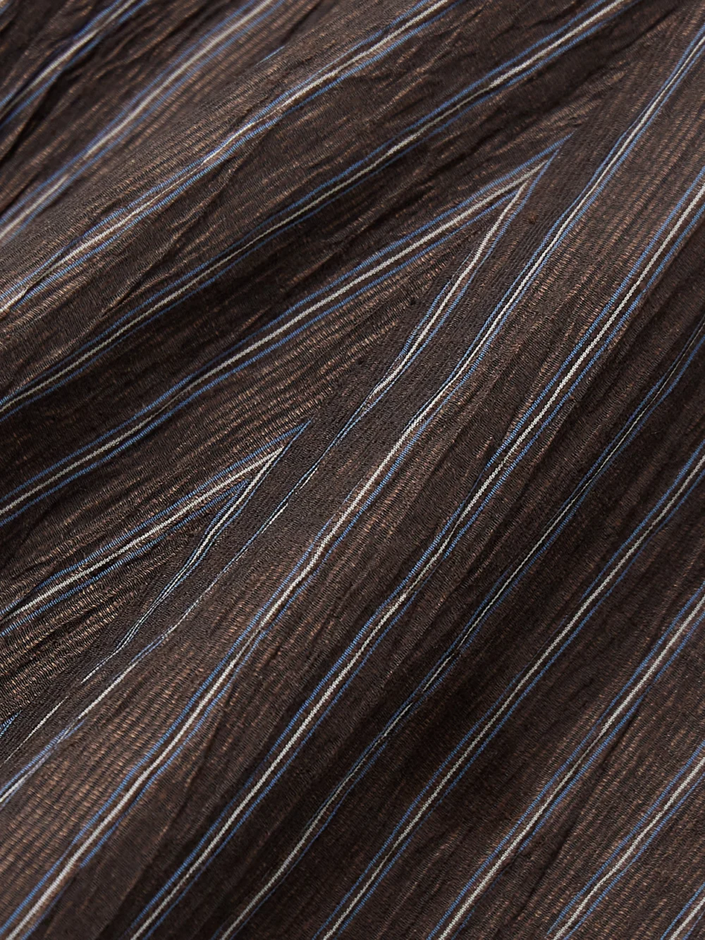 Close-up detail of the Abadia Tie-detailed Pinstriped Linen-blend Midi Skirt