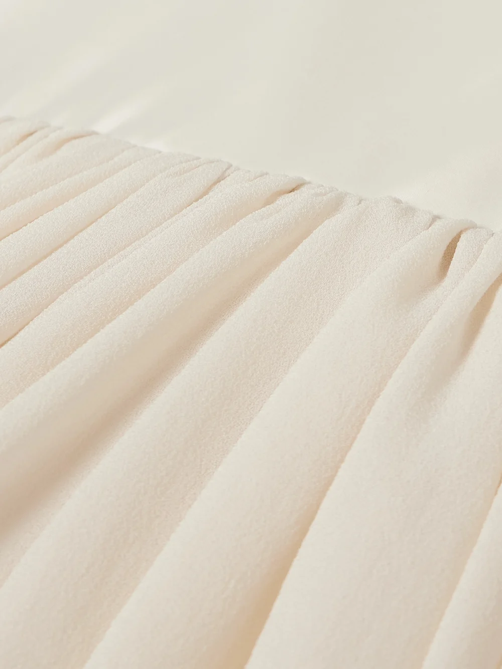 Close-up detail of the Abadia Waterfall Satin-trimmed Crepe De Chine Midi Skirt