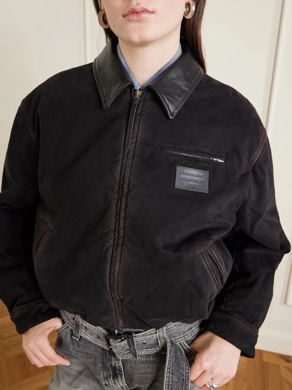 Close-up detail of the Acne Studios Appliquéd Leather-trimmed Distressed Cotton-twill Jacket