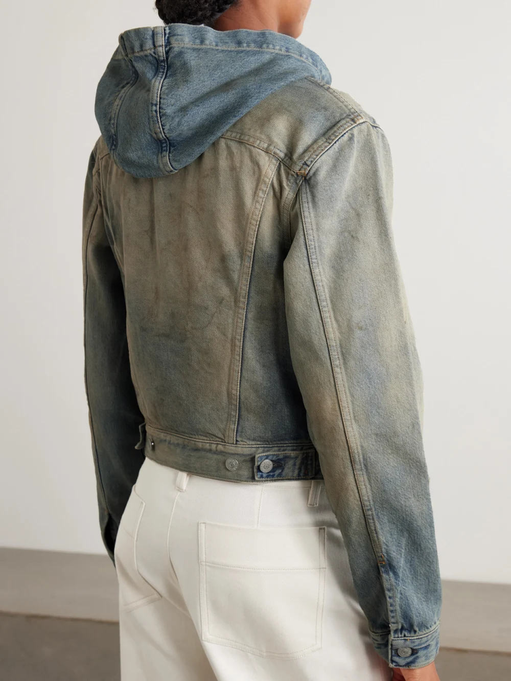 Back view of the Acne Studios Hooded Distressed Organic Denim Jacket
