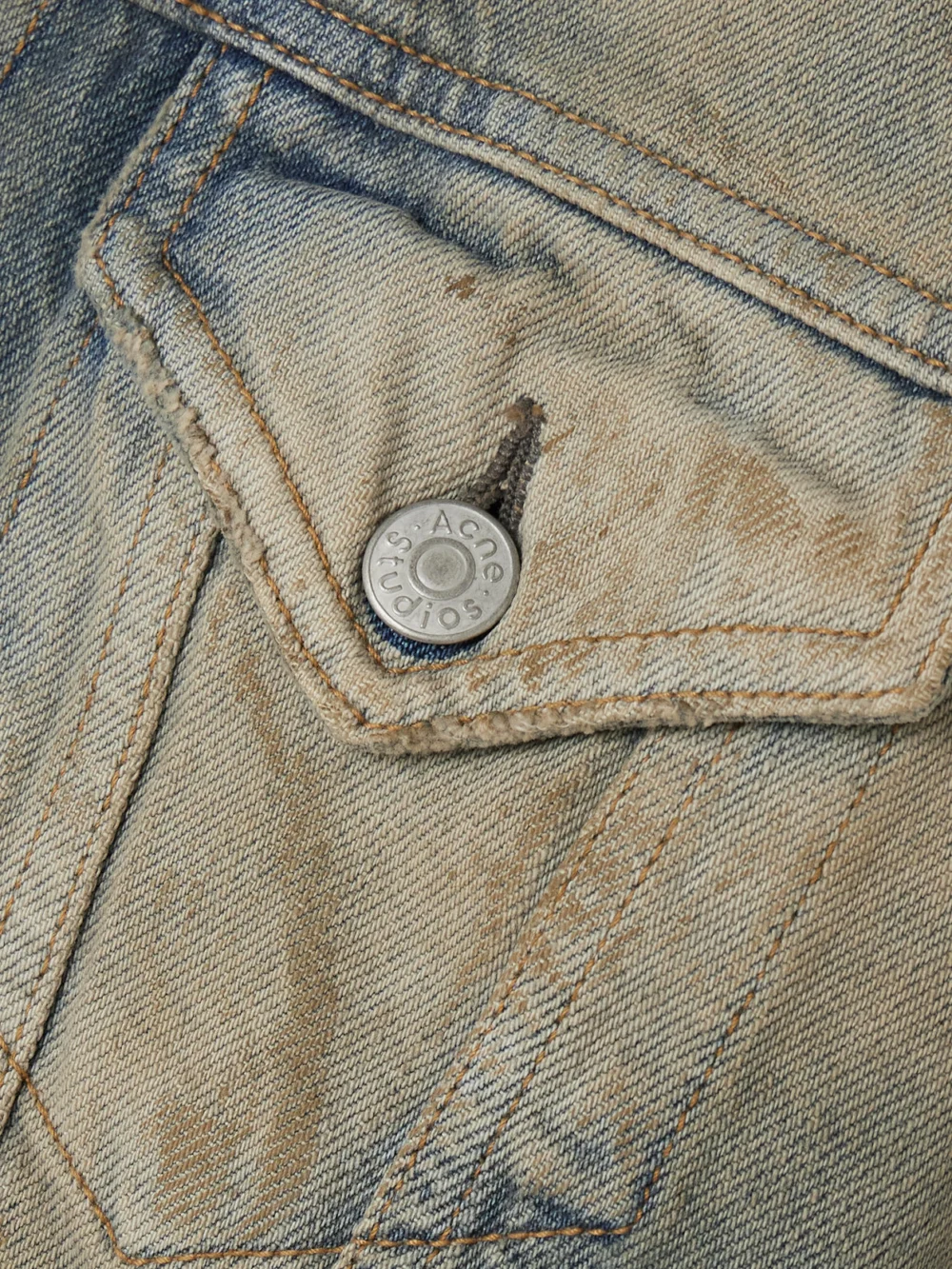 Close-up detail of the Acne Studios Hooded Distressed Organic Denim Jacket