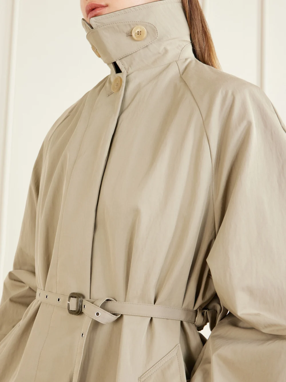 Close-up detail of the Acne Studios Ofelia Belted Leather-trimmed Cotton-blend Trench Coat