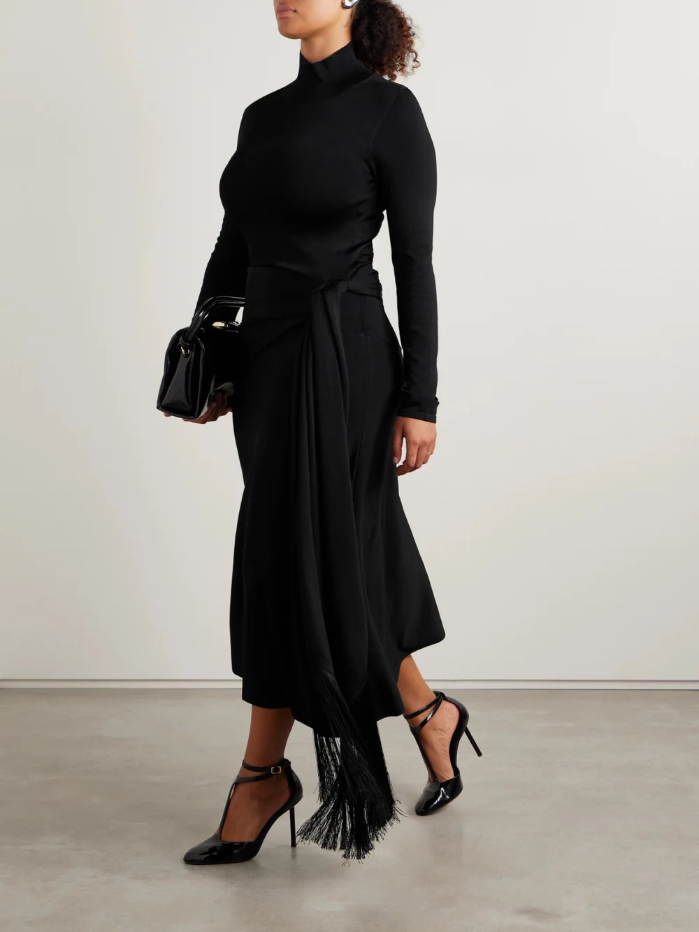 Adam Lippes Asymmetric Draped Fringed Stretch-knit Turtleneck Midi Dress, worn by a model