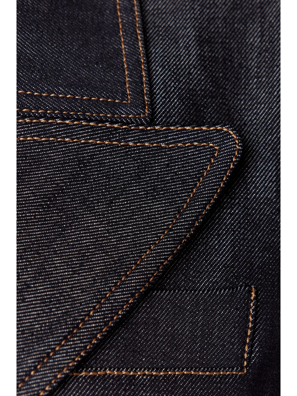 Close-up detail of the Adam Lippes Belted Double-breasted Denim Jacket