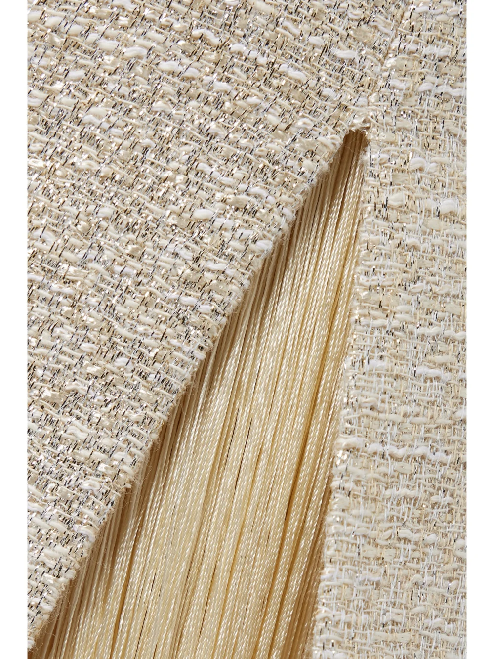 Close-up detail of the Adam Lippes Fringed Metallic Tweed Maxi Dress