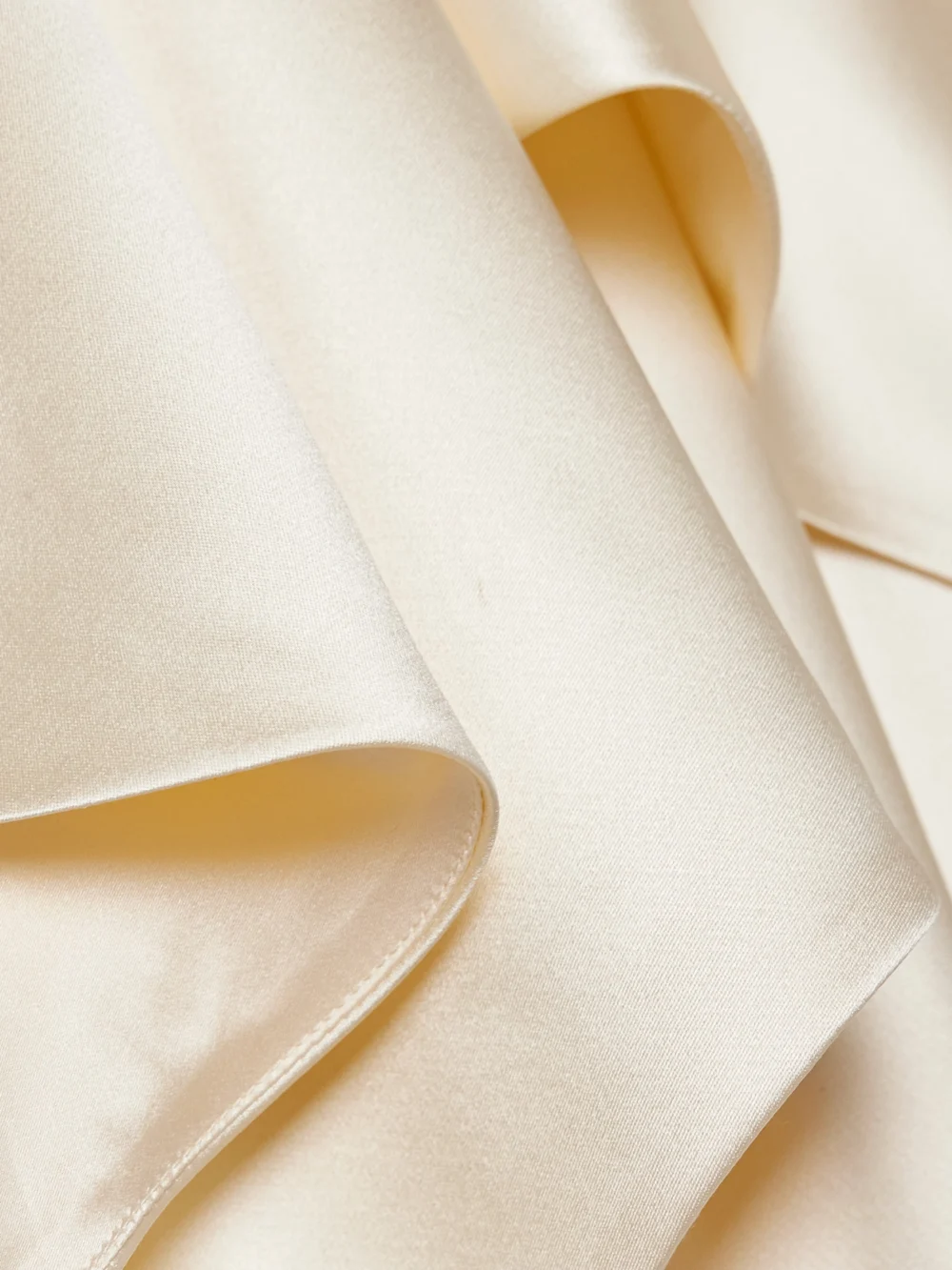 Close-up detail of the Adam Lippes Larys Layered Asymmetric Cape-effect Silk-charmeuse Maxi Dress
