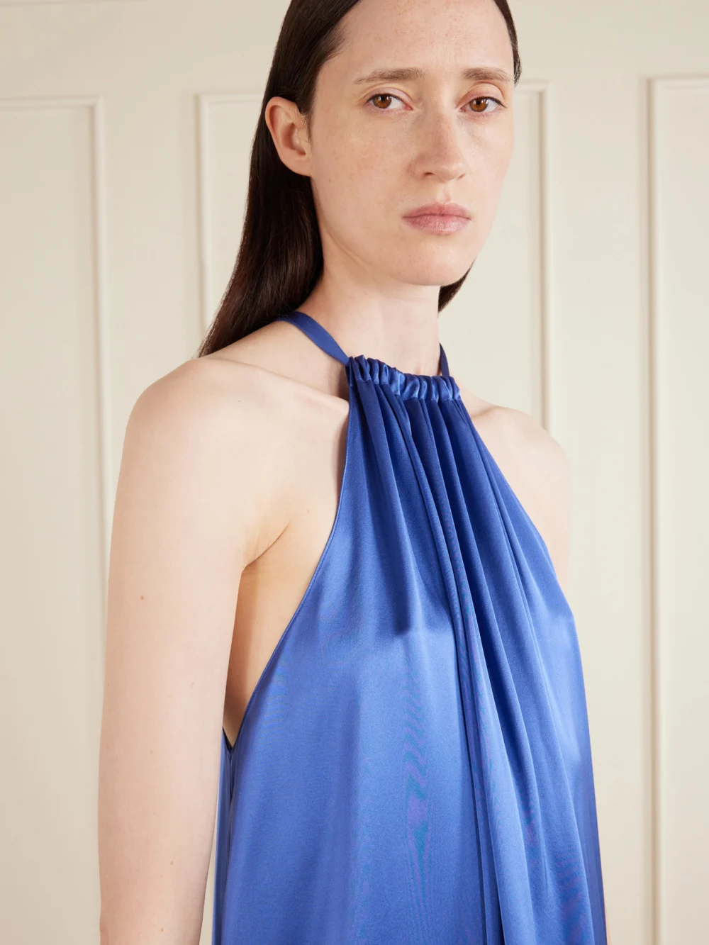 Close-up detail of the Aflalo Bexley Gathered Silk-satin Halterneck Mini Dress
