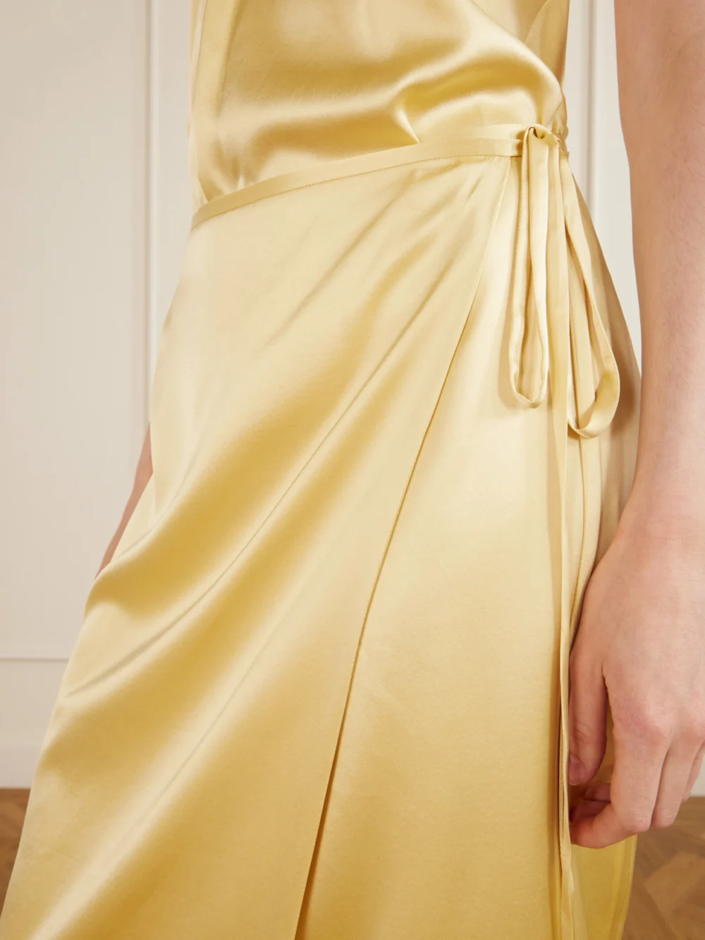 Close-up detail of the Aflalo Rixa Satin Wrap Midi Skirt
