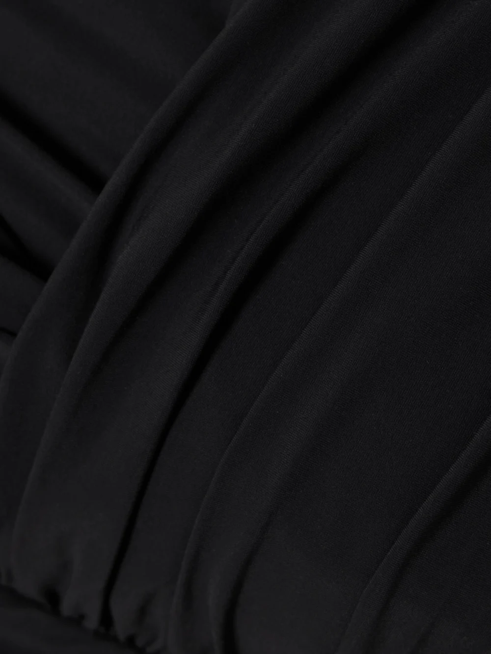 Close-up detail of the Agolde Etienne Off-the-shoulder Ruched Stretch-jersey Thong Bodysuit