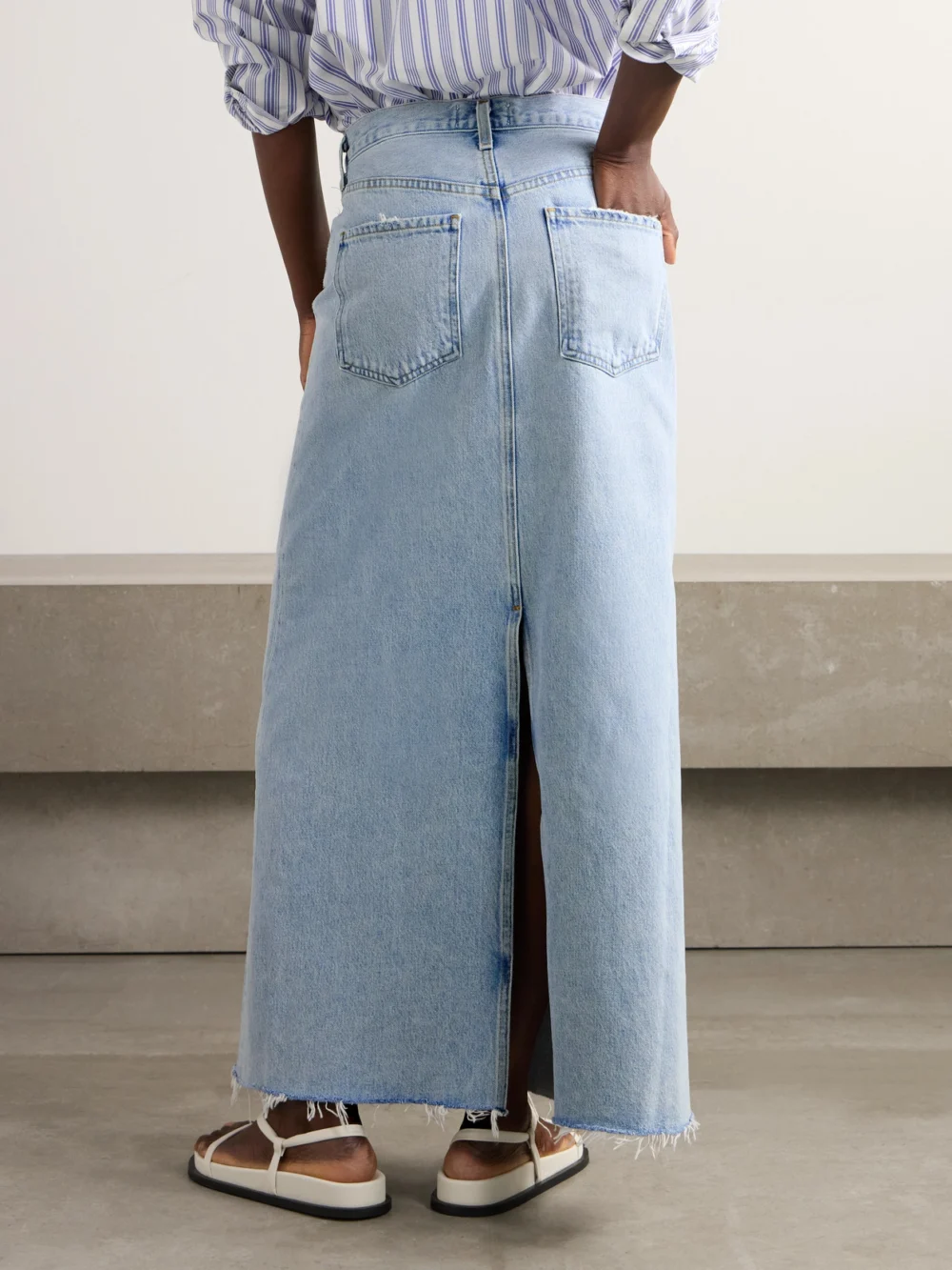 Back view of the Agolde Hilla Frayed Organic Denim Maxi Skirt