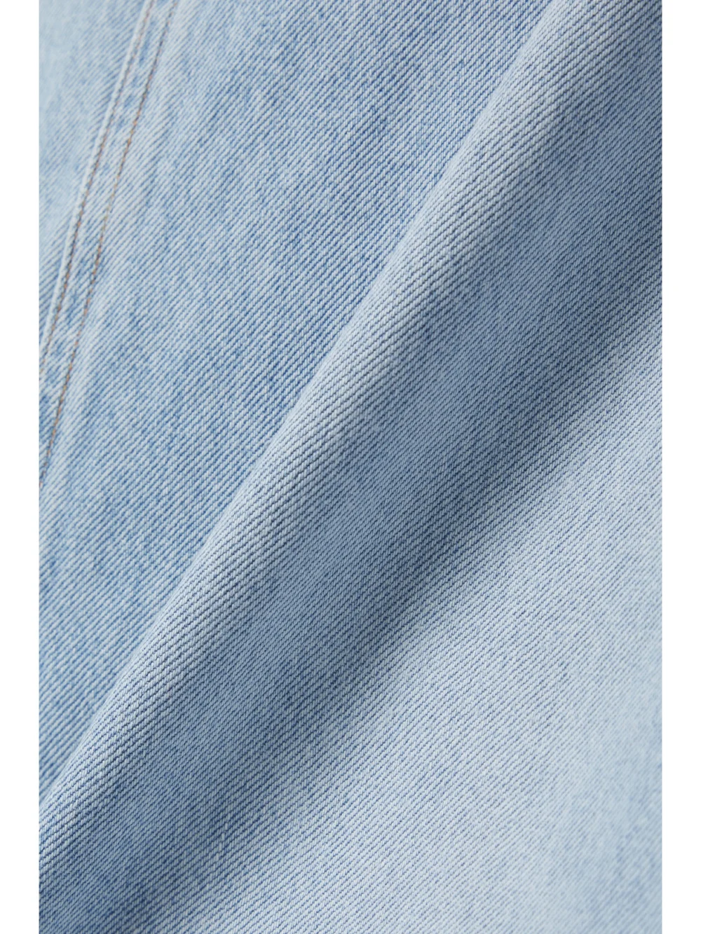 Close-up detail of the Agolde Hilla Frayed Organic Denim Maxi Skirt