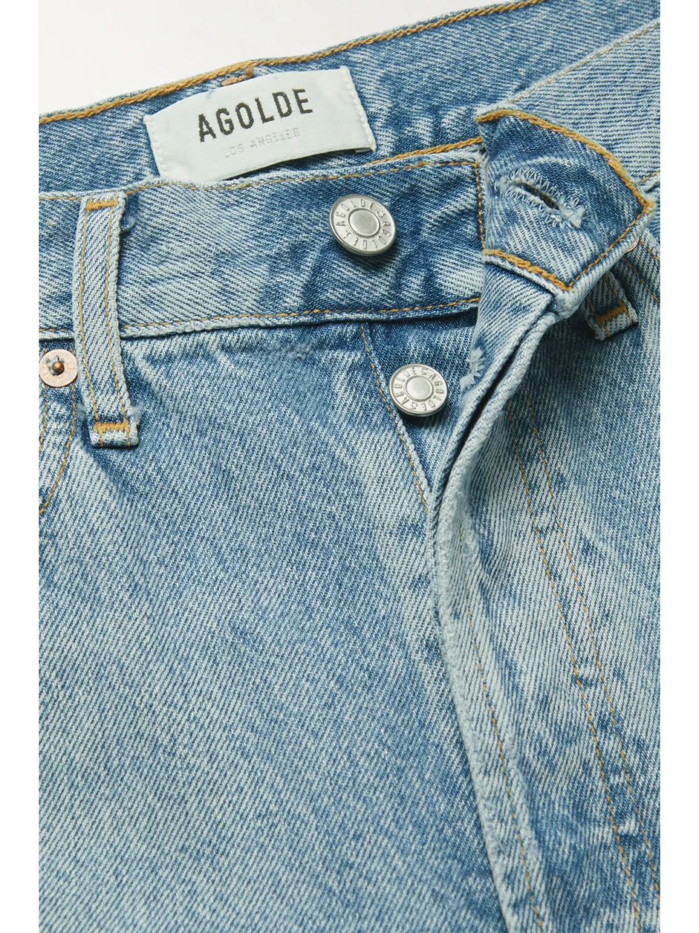 Close-up detail of the Agolde Riley Distressed Cropped Organic High-rise Straight-leg Jeans
