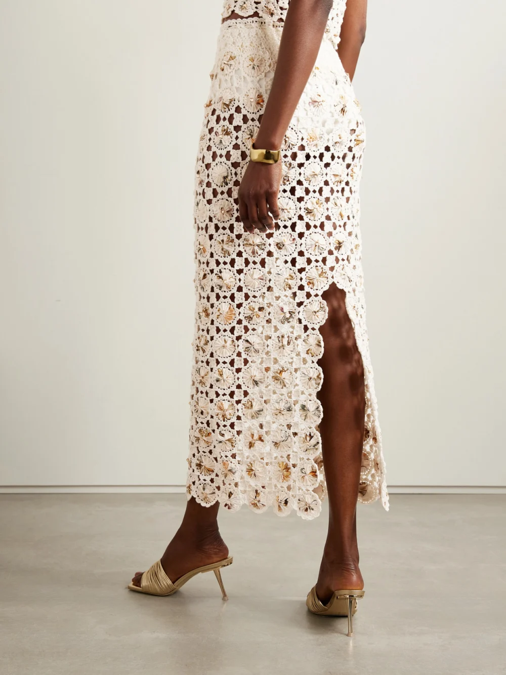 Back view of the Agua by Agua Bendita Arroyo Caracola Embellished Printed Crepe and Crocheted Cotton Midi Skirt