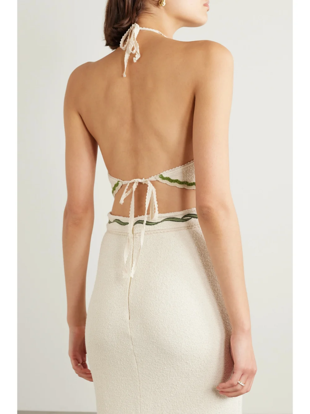 Back view of the Agua by Agua Bendita Carlota Flora Cropped Appliquéd Cotton-blend Bouclé Halterneck Top