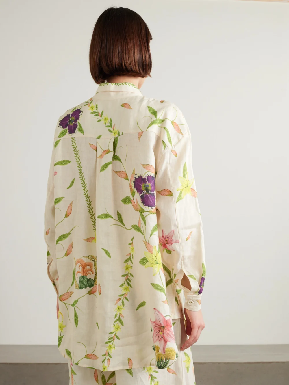 Back view of the Agua by Agua Bendita Cecilia Marina Oversized Floral-print Linen Shirt