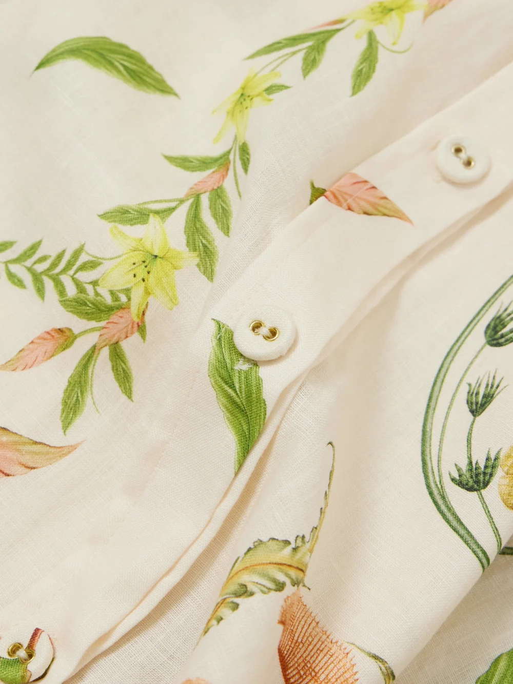 Close-up detail of the Agua by Agua Bendita Cecilia Marina Oversized Floral-print Linen Shirt