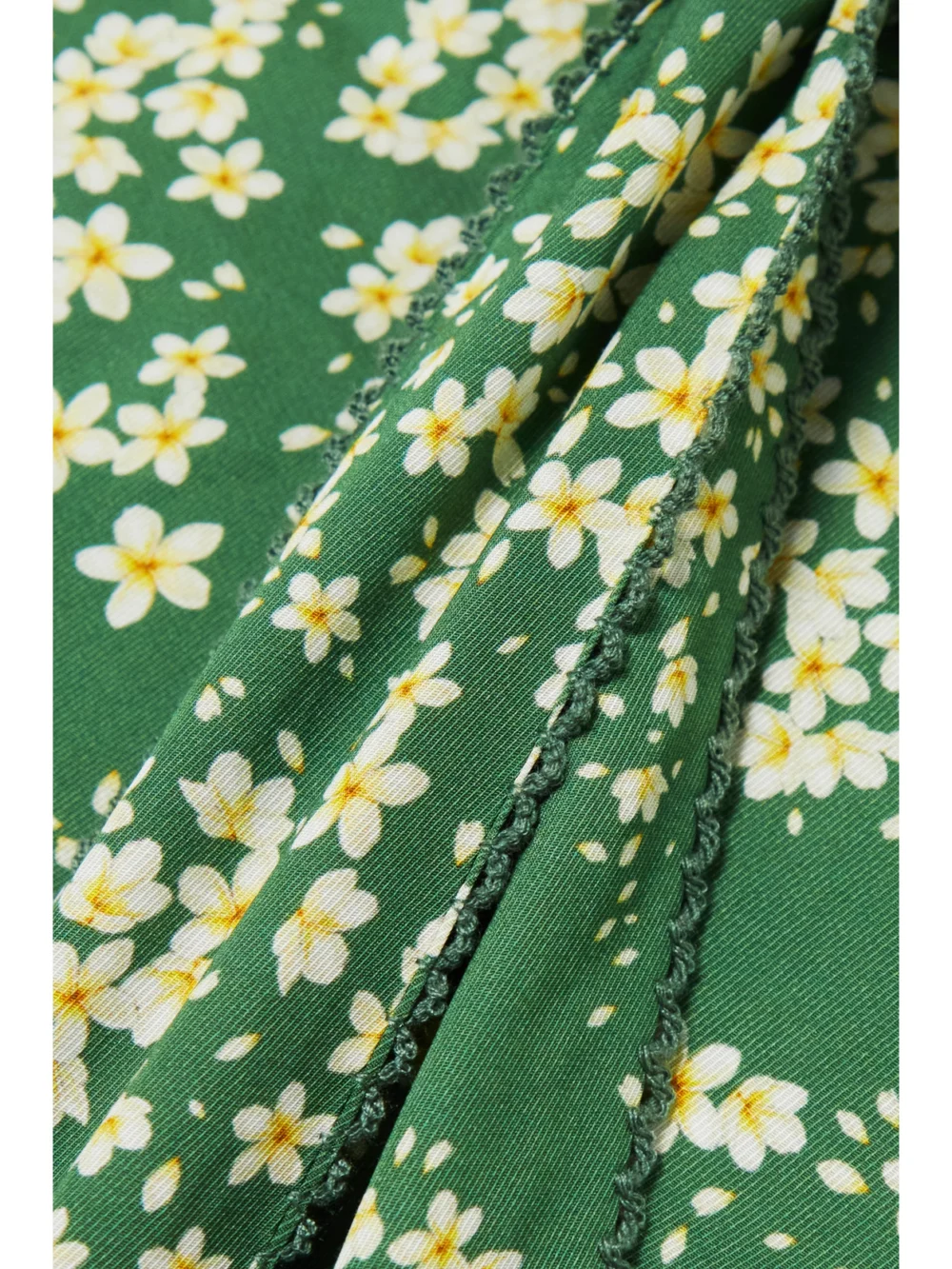 Close-up detail of the Agua by Agua Bendita Cuarzo Astro Esmeralda Cutout Floral-print Twill Maxi Dress