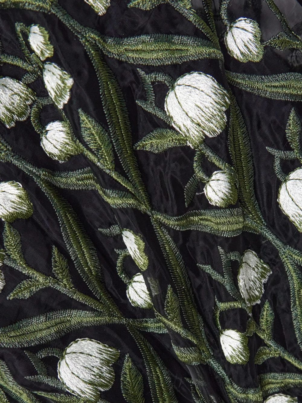 Close-up detail of the Agua by Agua Bendita Ellisella Perla Embroidered Tulle Maxi Dress