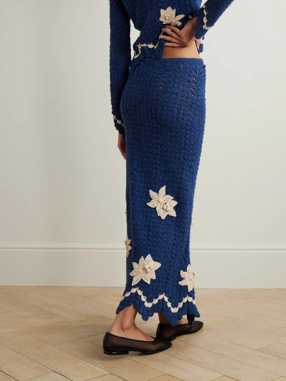 Back view of the Agua by Agua Bendita + Escvdo Muhu Crocheted Alpaca Midi Skirt