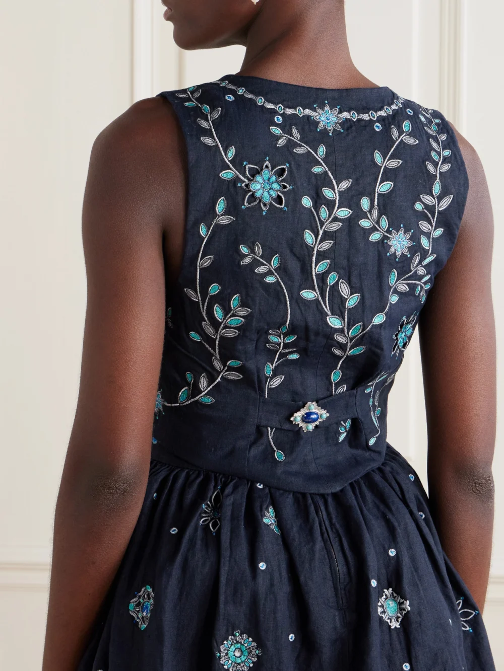 Back view of the Agua by Agua Bendita Esmeralda Relicario Embroidered Linen Cropped Top