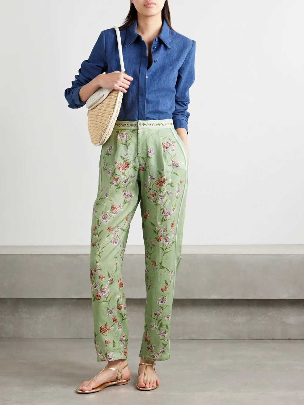 Agua by Agua Bendita Florecer Honeysuckle Pleated Embroidered Floral-print Linen Tapered Pants, worn by a model