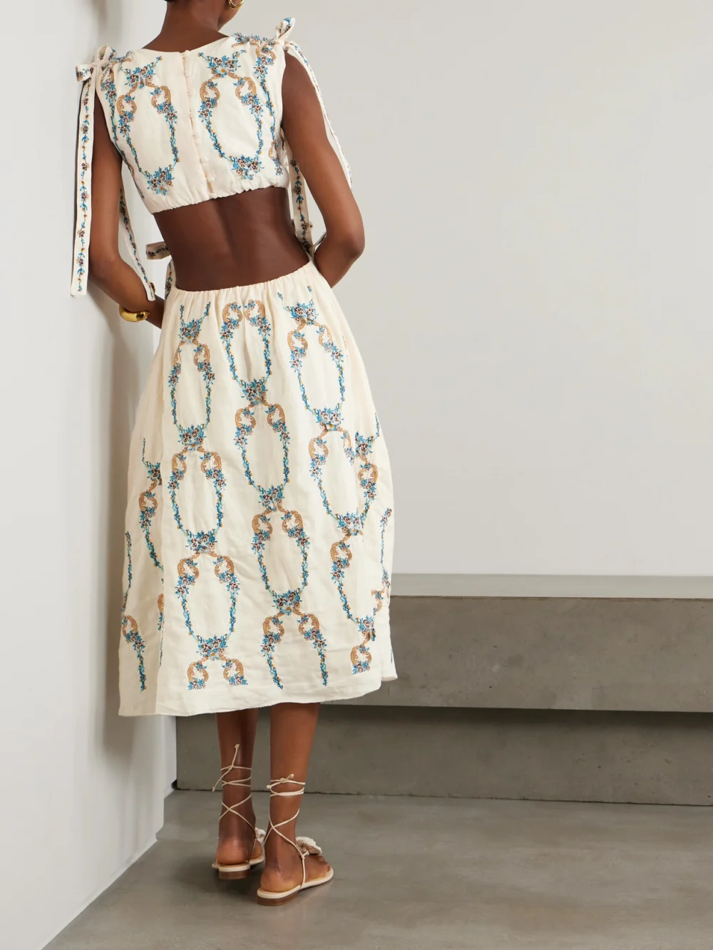 Back view of the Agua by Agua Bendita Guaguancò Florero Tie-detailed Cutout Embroidered Linen Midi Dress