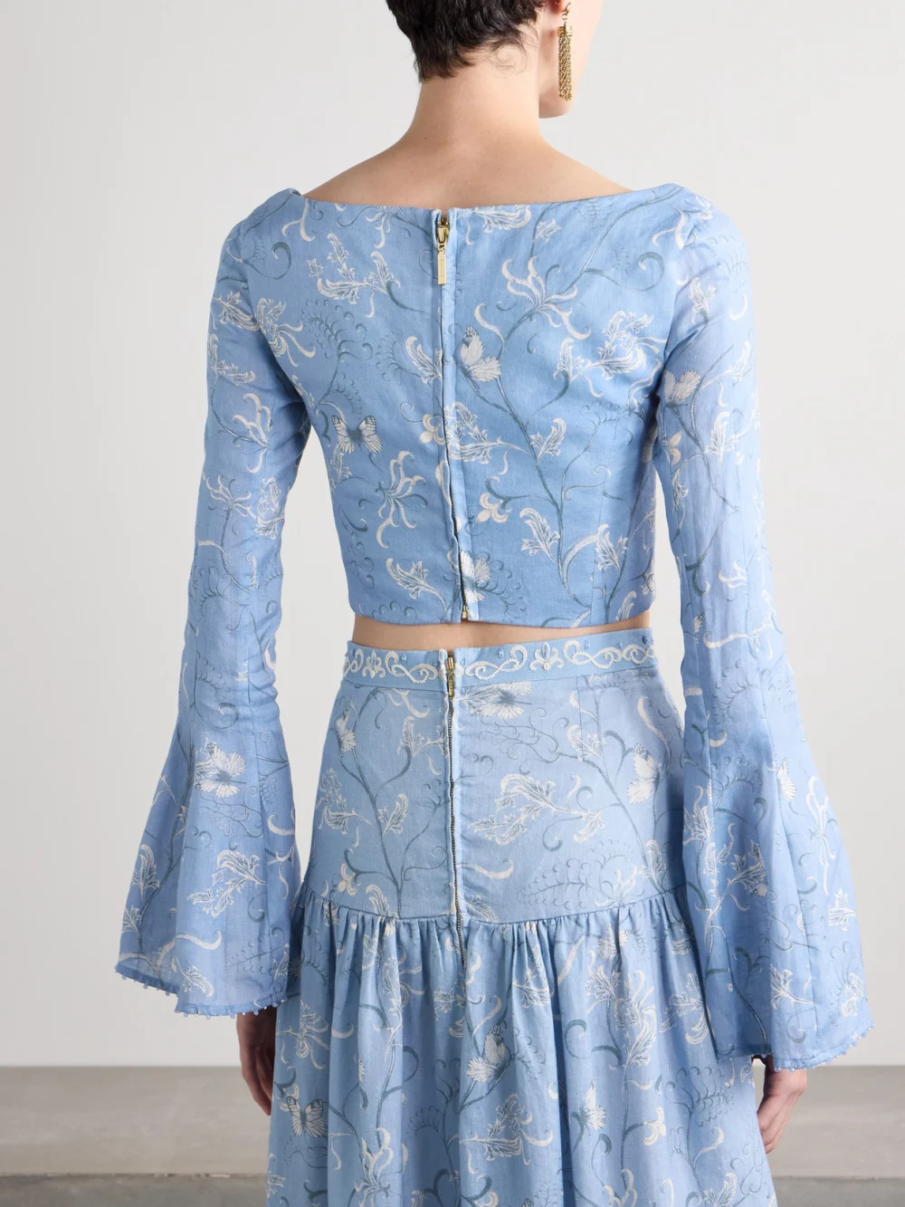 Back view of the Agua by Agua Bendita Limoncillo Lymanopoda Cropped Bead-embellished Printed Linen Top