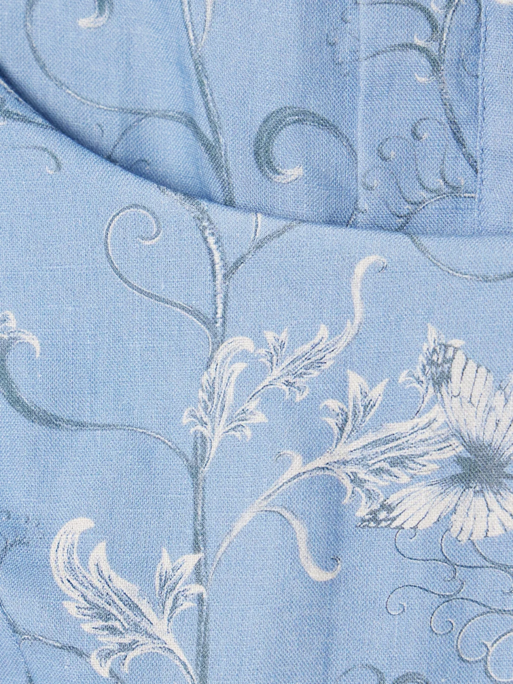 Close-up detail of the Agua by Agua Bendita Limoncillo Lymanopoda Cropped Bead-embellished Printed Linen Top