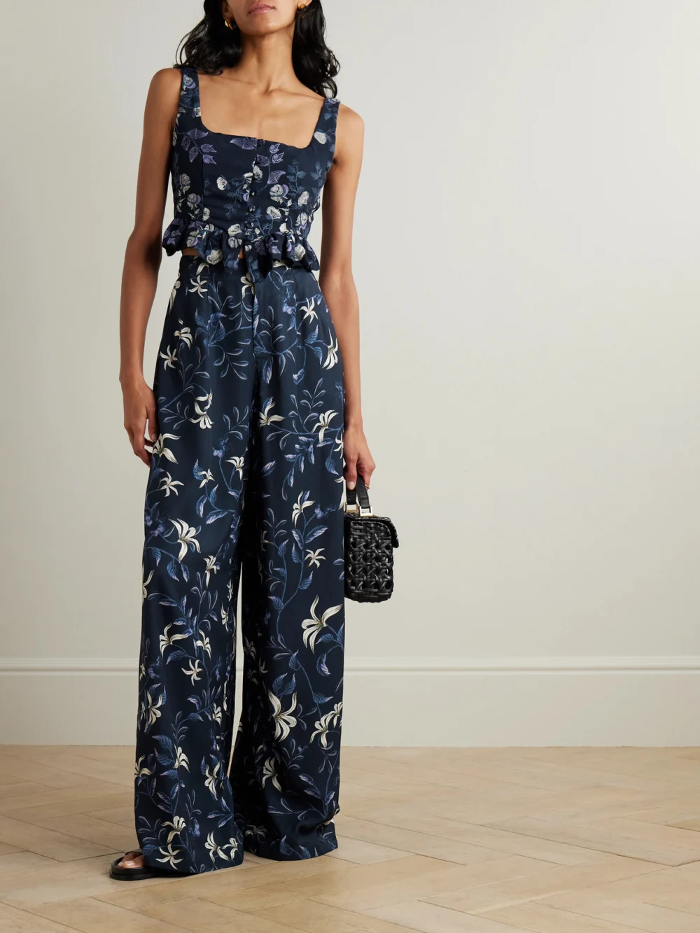 Agua by Agua Bendita Piñon Café Floral-print Recycled-twill Wide-leg Pants, worn by a model