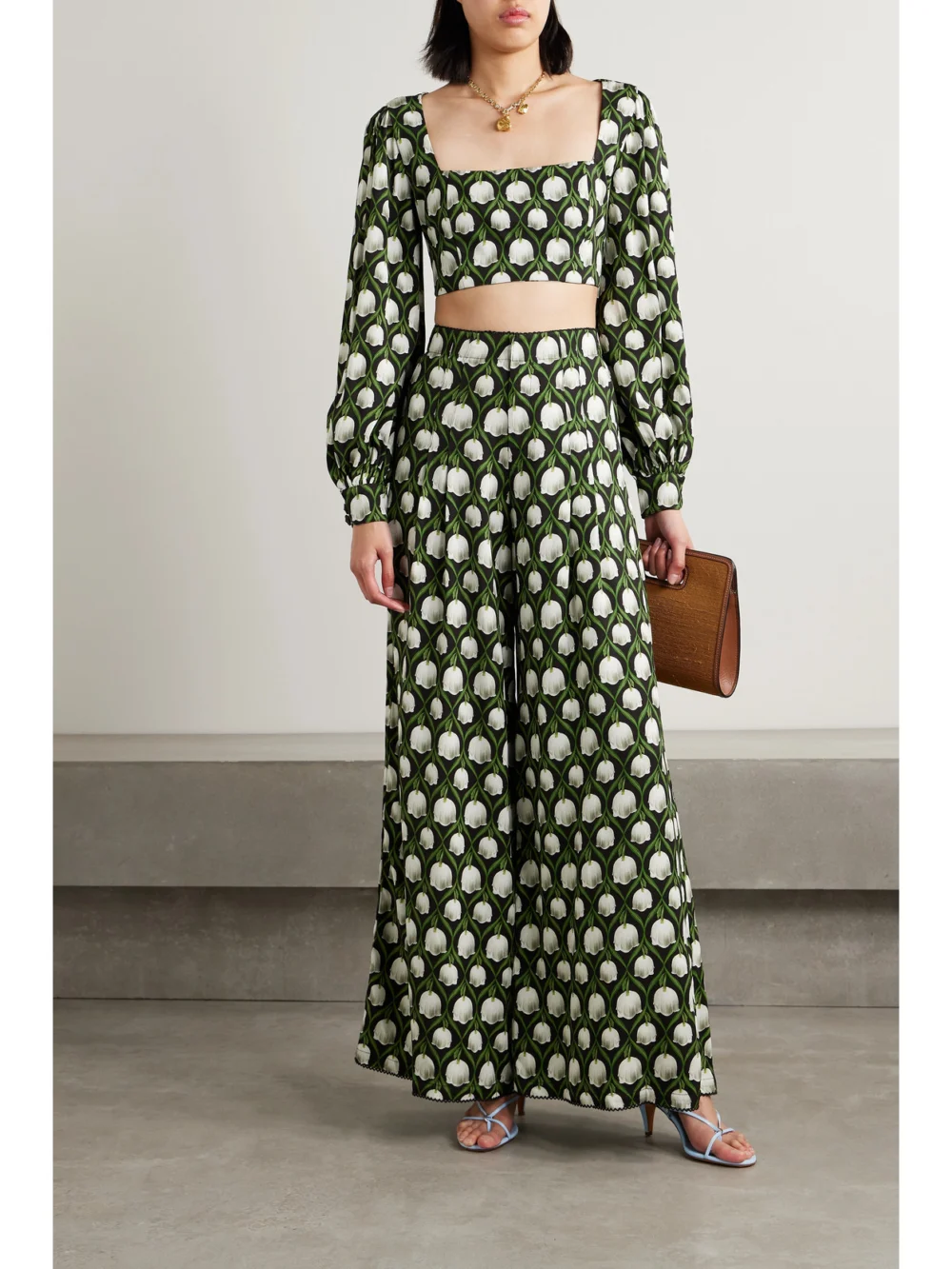 Agua by Agua Bendita Piñon Pleated Floral-print Recycled-twill Wide-leg Pants, worn by a model
