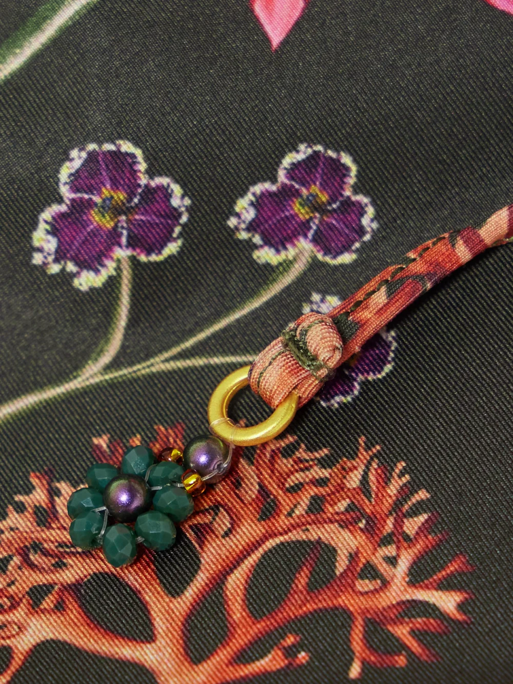 Close-up detail of the Agua by Agua Bendita Poema Habitat Embellished Floral-print Recycled Bikini Briefs