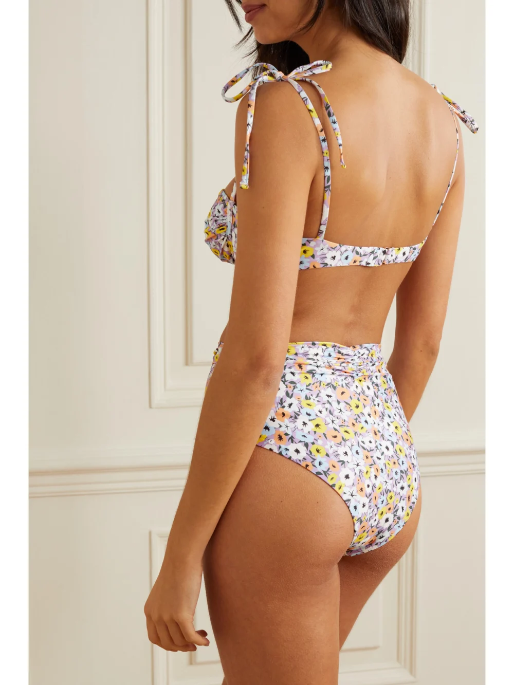 Back view of the Agua by Agua Bendita Vaiven Ruched Floral-print Recycled Bikini Bottoms