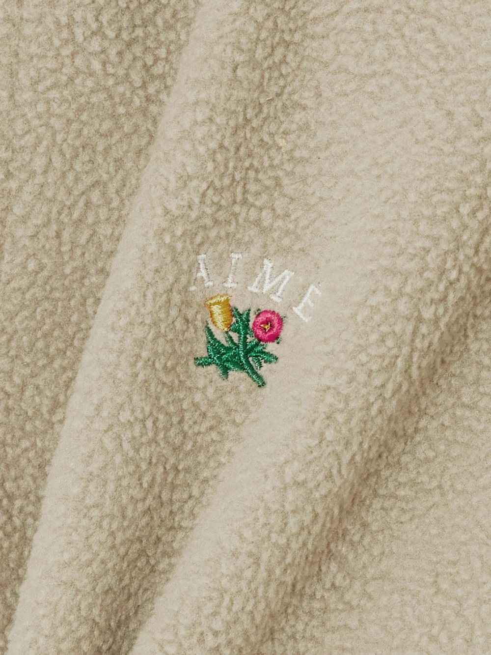 Close-up detail of the Aimé Leon Dore Embroidered Fleece Sweatshirt
