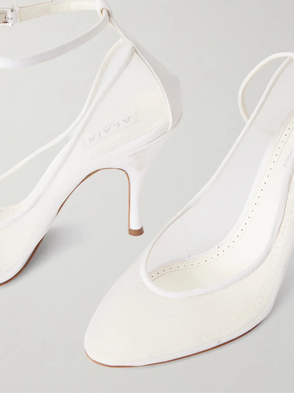 Close-up detail of the Alaïa 100 Grosgrain-trimmed Tulle Pumps
