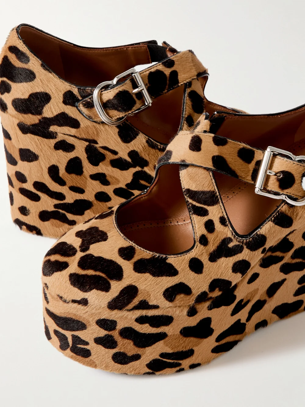 Close-up detail of the Alaïa 110 Leopard-print Calf Hair Platform Wedge Pumps