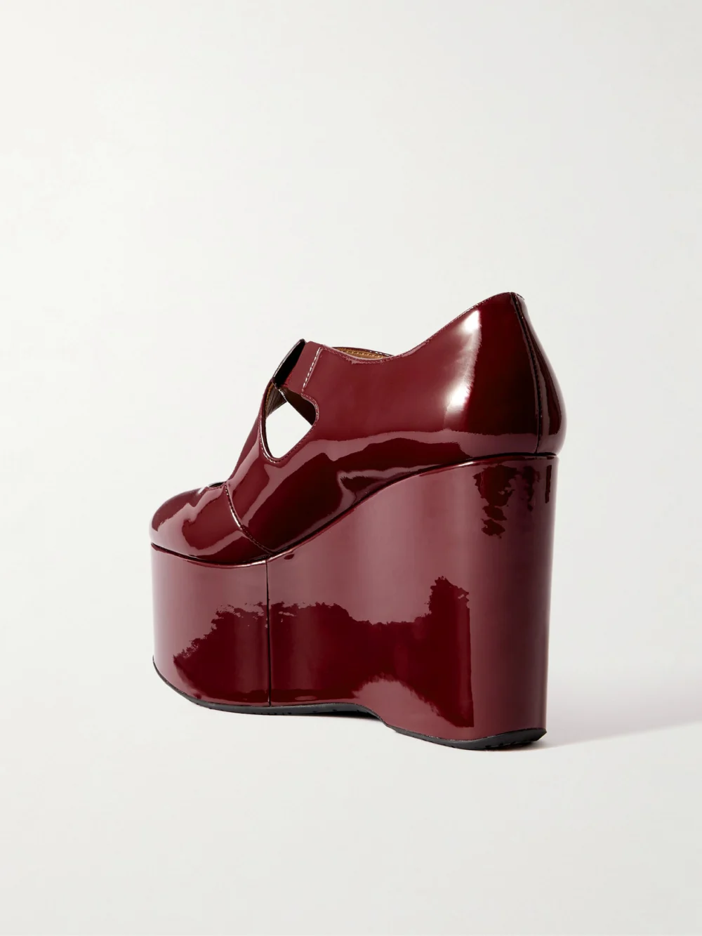 Back view of the Alaïa 110 Patent-leather Platform Wedge Mary Jane Pumps