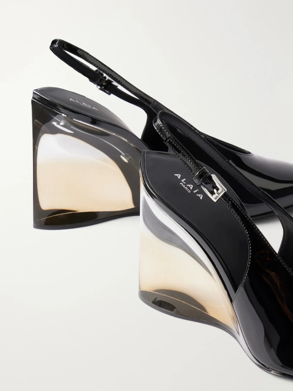 Close-up detail of the Alaïa 110 Patent-leather Wedge Pumps