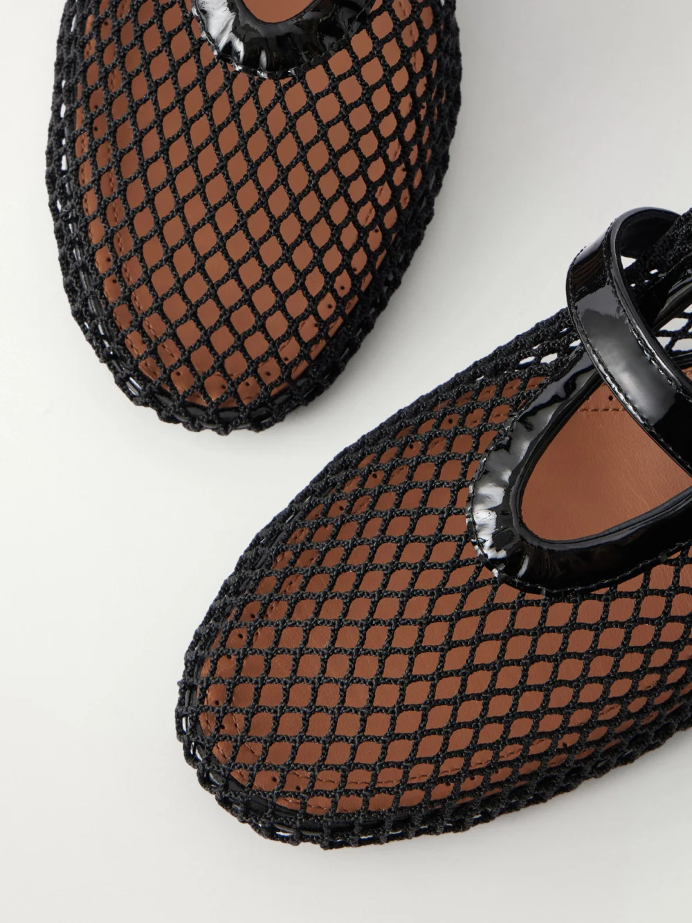 Close-up detail of the Alaïa 55 Patent Leather-trimmed Mesh Pumps