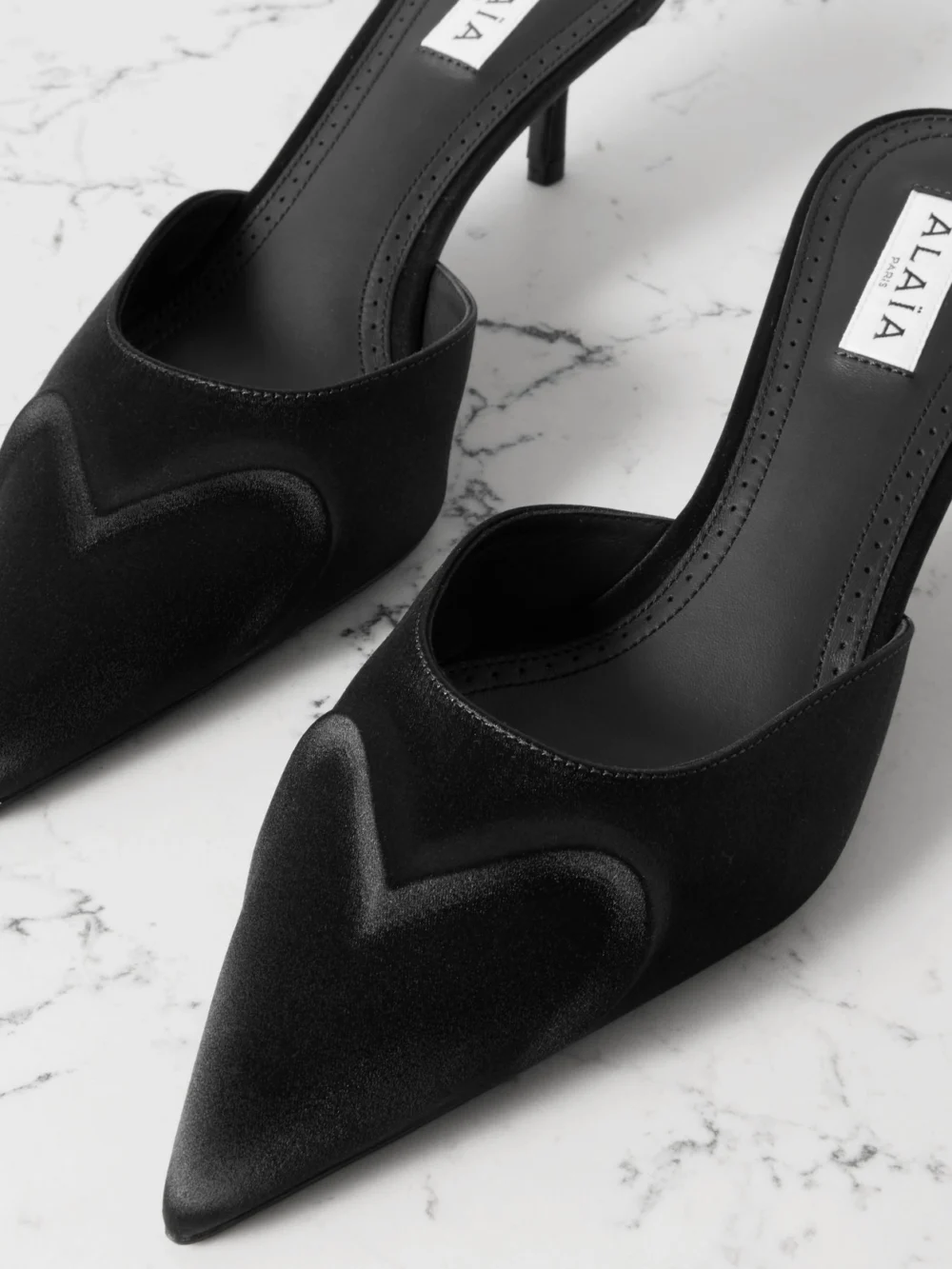 Close-up detail of the Alaïa 55 Satin Mules