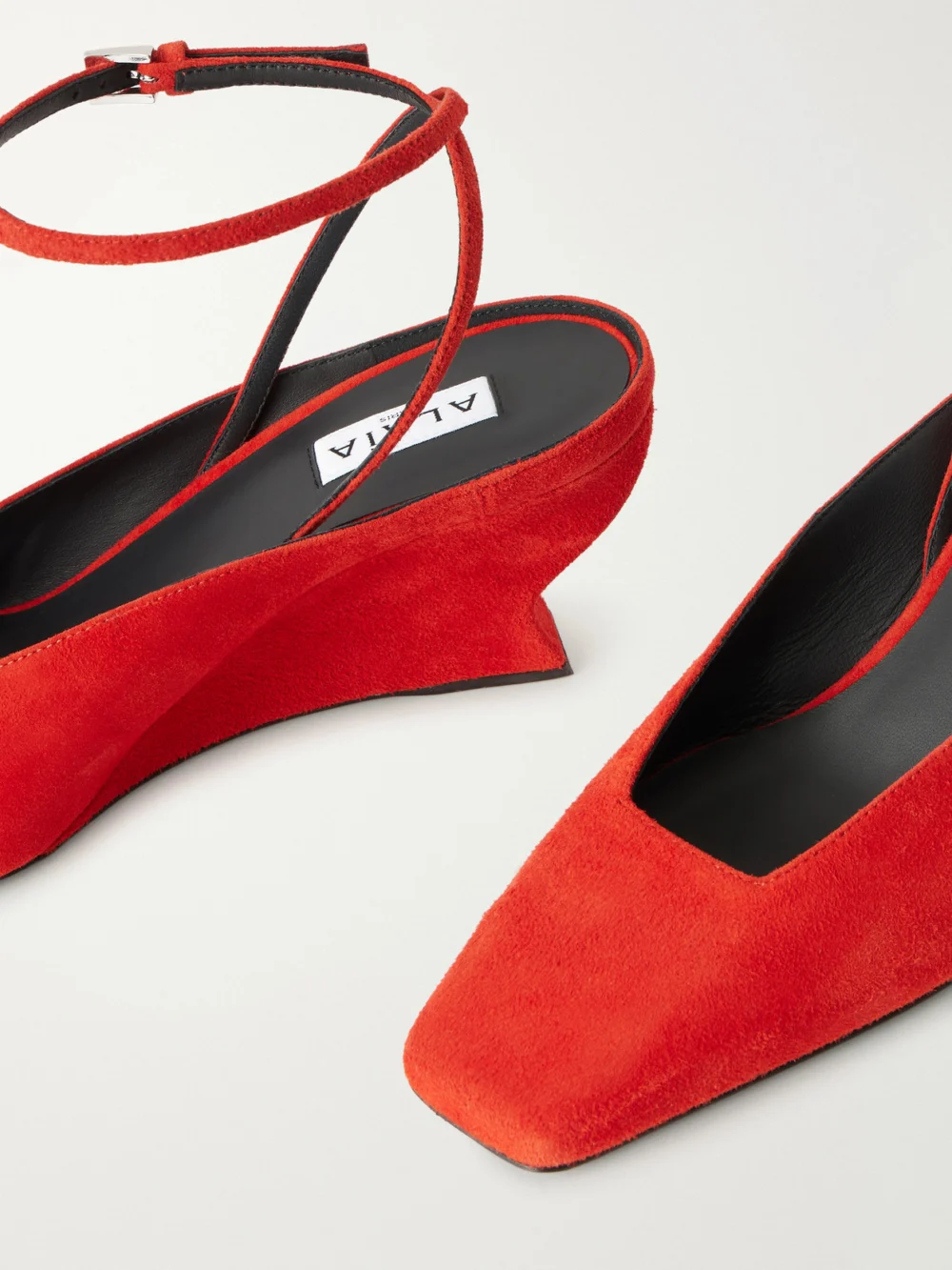 Close-up detail of the Alaïa 60 Suede Wedge Pumps