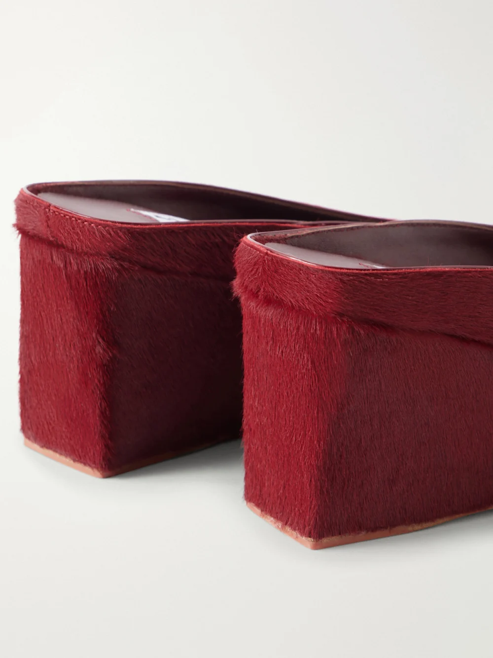 Close-up detail of the Alaïa 75 Calf Hair Wedge Mules