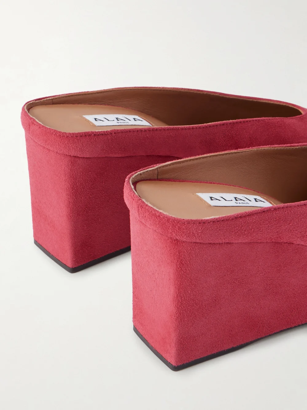 Close-up detail of the Alaïa 75 Suede Point-toe Wedge Mules