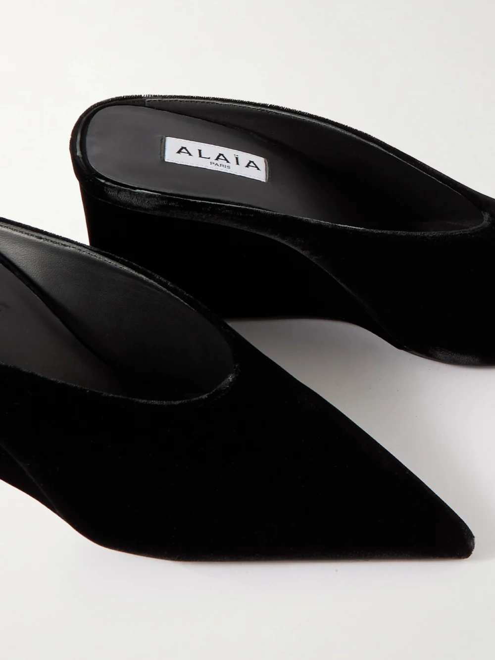 Close-up detail of the Alaïa 75 Velvet Wedge Mules