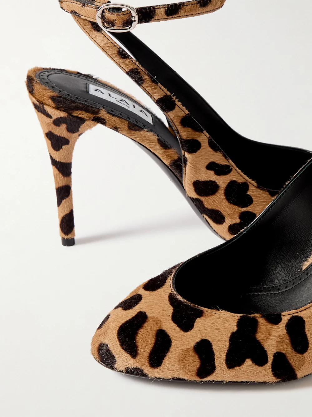 Close-up detail of the Alaïa 90 Leopard-print Calf Hair Pumps