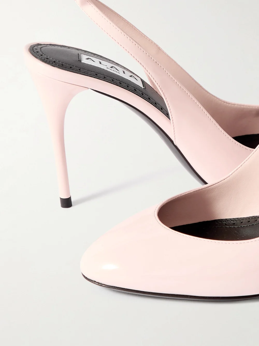 Close-up detail of the Alaïa 90 Patent-leather Pumps