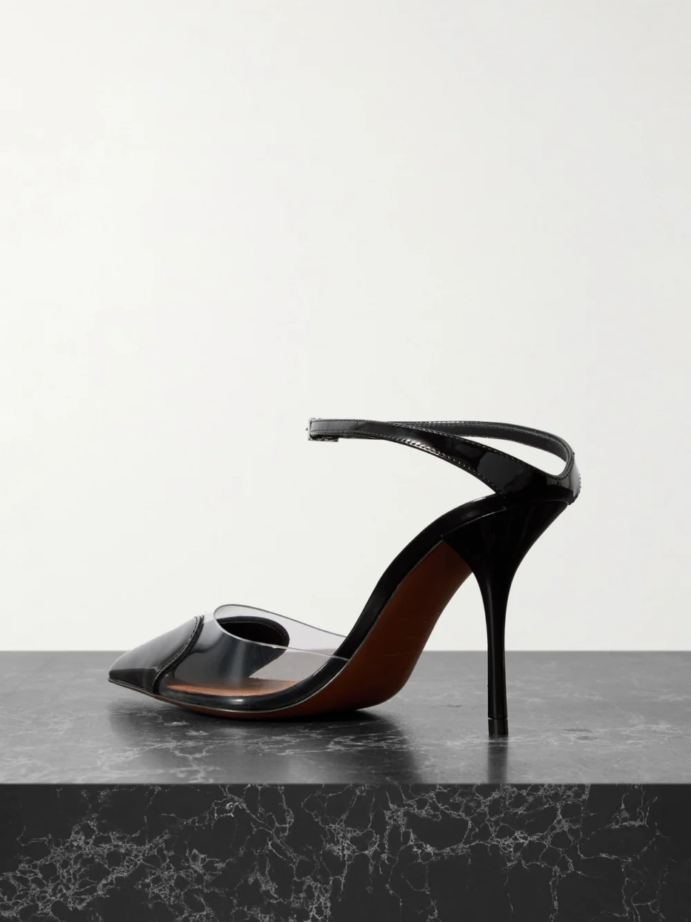 Back view of the Alaïa Caur 90 Pu and Patent-leather Pumps